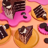 Oreo Cookies & Cream Cake with layers of chocolate sponge, Oreo buttercream, ganache drip, and Oreo toppings.